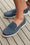A close up of Velasca blue nubuck leather penny-style boat shoes.
